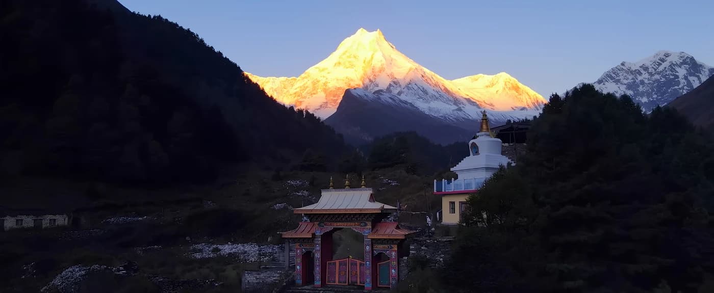 Lho Monastery with sunrise views of Mount Manaslu on the Manaslu Circuit Trek in Nepal by Thrill Himalaya Treks