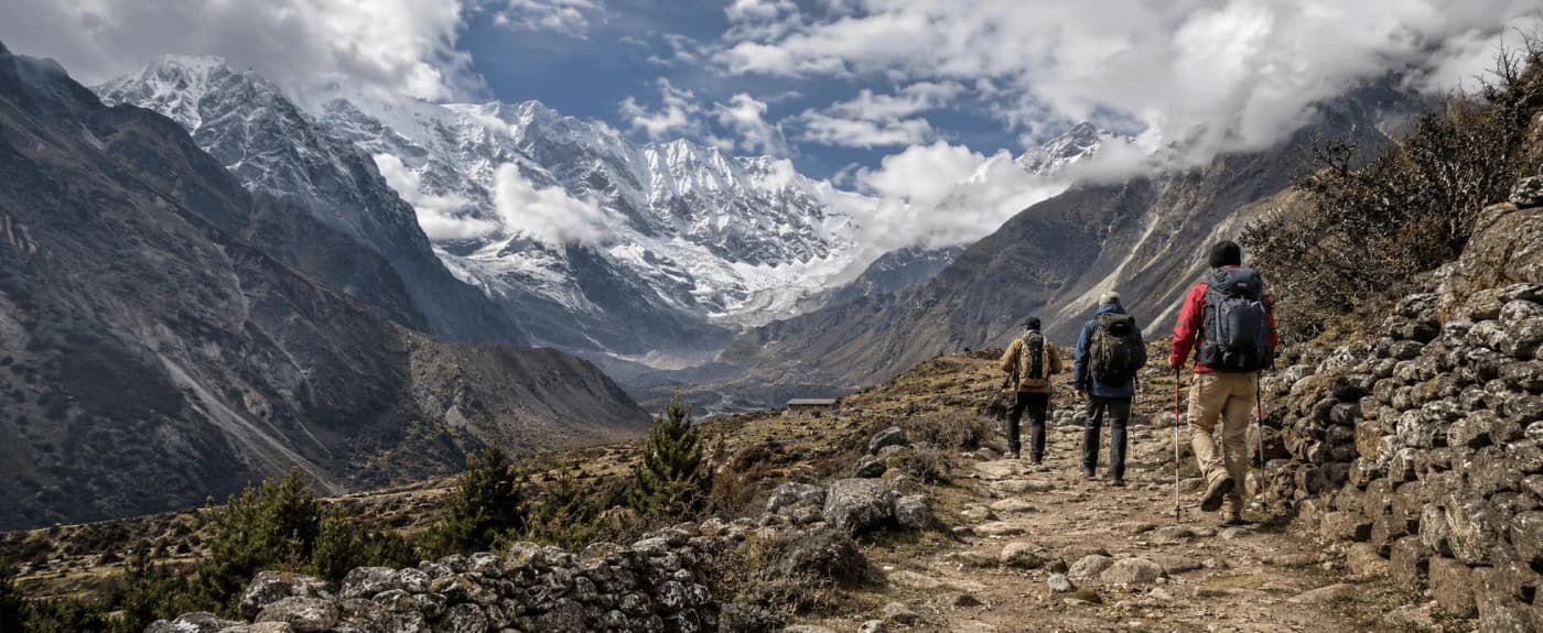 Trekkers hiking the Manaslu Circuit trail through the Himalayan mountains